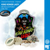 Digitální grafika od 187 Seeds: produkt King Kong's Lady Cannabis s rozzlobenou gorilou před městskou krajinou, fialovými a zelenými květy konopí a béžově zbarvenými semeny konopí.
