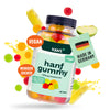 Product photo of Hans+ Hanf Gummy, a vegan product from Germany, with an image of colorful gummy bears, apple slices and lemon slices in splashes of juice, and the German flag on the label
