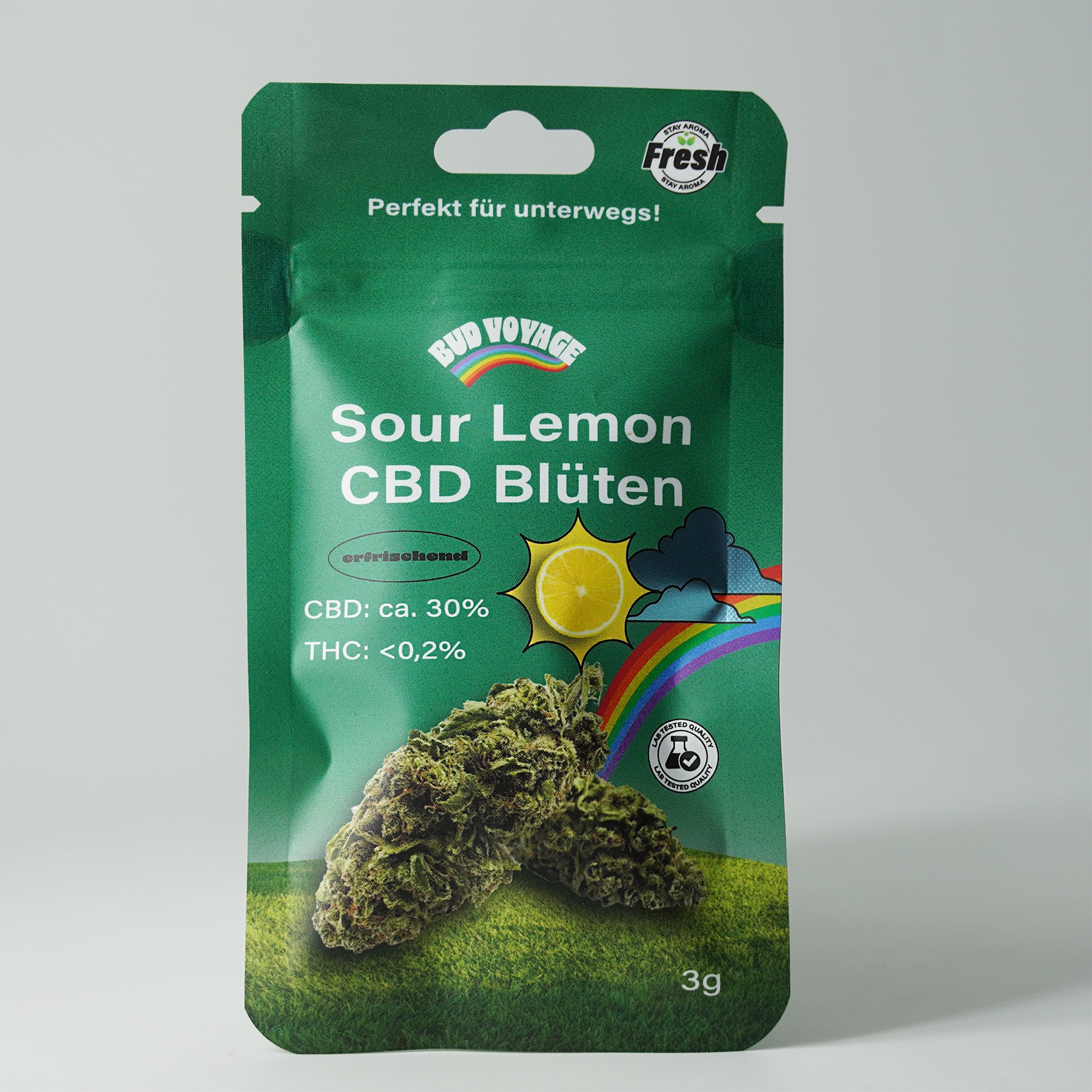 Bud Voyage product packaging: Image of a 3g pack of Sour Lemon CBD flowers with a rainbow, a lemon and a quality seal on a green background
