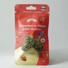 Bud Voyage product packaging: Strawberry Haze CBD flowers, showing two CBD flowers and strawberries on a red background with rainbow and rocket motif fruity and 18% CBD
