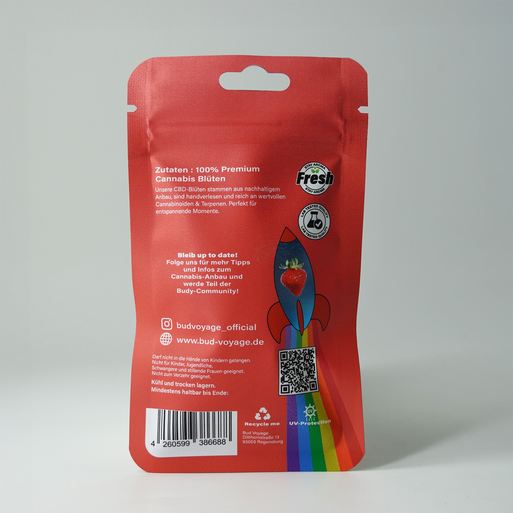 Bud Voyage packaging: Premium cannabis flowers in red packaging with rocket motif, strawberry and rainbow colors, UV protection and QR code.
