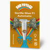 Bud Voyage graphic design: Gorilla Glue F1 Automatic seeds, three feminized seeds in a microtube against a background of a rainbow and a blue wave, with detailed cannabis flowers and a golden background