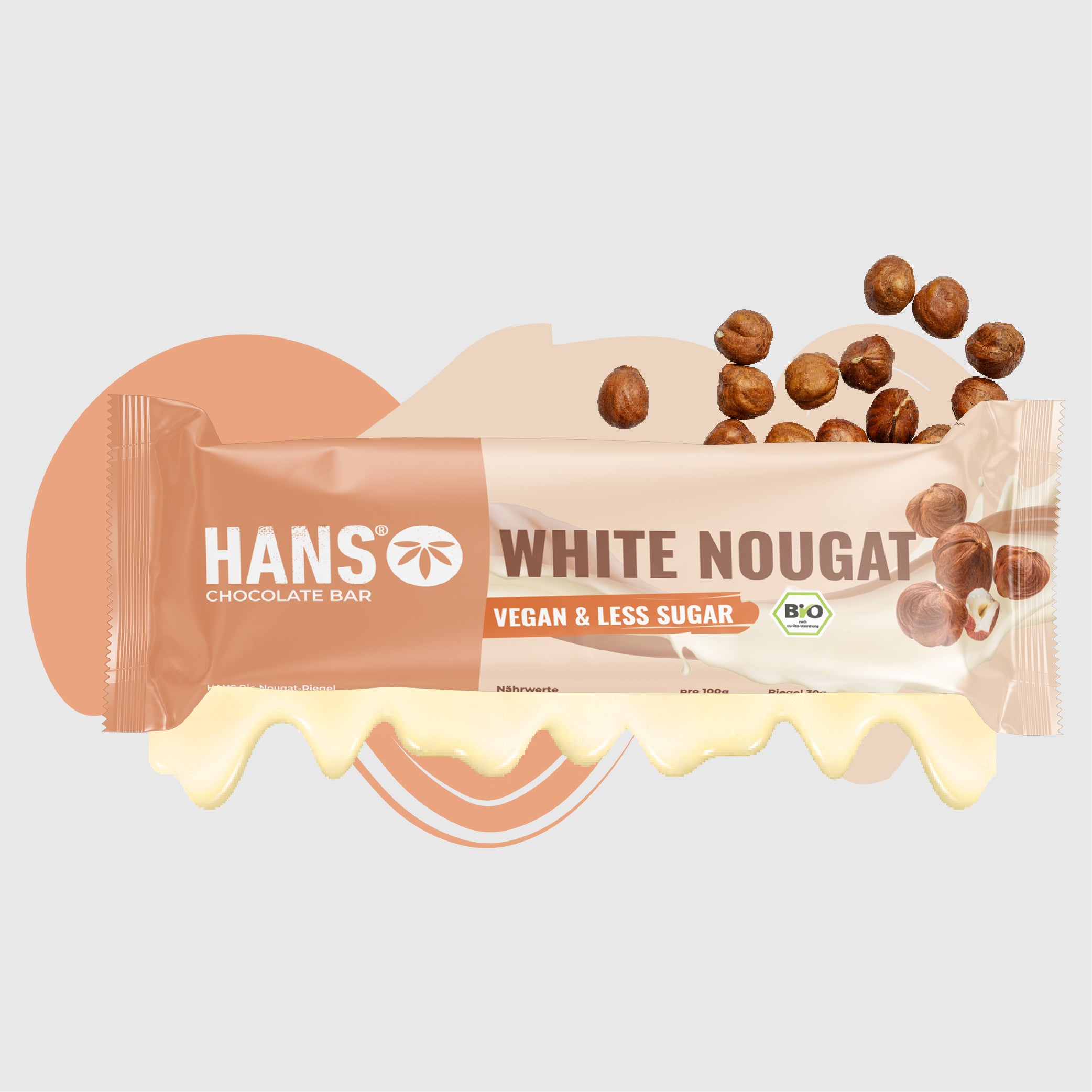 Product image: A Hans organic chocolate bar with a white nougat filling, surrounded by hazelnuts, with vegan and sugar-reduced properties and a creamy overflow
