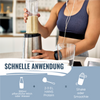 Photography: Woman preparing a creamy, light beige smoothie in a modern kitchen with a silver blender containing a light brown protein powder and wearing a smartwatch

