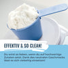 Photograph of white powder in a blue plastic scoop on a white scale showing a textured surface and a bright, clean appearance
